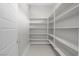 Walk-in pantry featuring ample shelving space for organized storage, accessible off the kitchen area at 9475 W Rosada Way, Las Vegas, NV 89149
