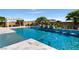 Beautiful backyard pool featuring a baja step, spa, and tile pool deck at 9475 W Rosada Way, Las Vegas, NV 89149