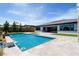 Beautiful backyard pool featuring a baja step, spa, and tile pool deck at 9475 W Rosada Way, Las Vegas, NV 89149