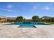 Luxury pool with waterfalls and mature landscaping creating a serene outdoor living space at 9475 W Rosada Way, Las Vegas, NV 89149