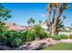 Tranquil backyard with desert landscaping, mature trees, and mountain views in a serene setting at 9524 Quail Ridge Dr, Las Vegas, NV 89134