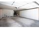 Spacious garage with built-in cabinets, a sink, and plenty of room for multiple vehicles at 9524 Quail Ridge Dr, Las Vegas, NV 89134