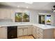 Kitchen featuring white countertops, wood cabinets, and a view of the backyard at 9524 Quail Ridge Dr, Las Vegas, NV 89134