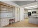 Kitchen featuring white cabinetry, black appliances, a desk, and skylights at 9524 Quail Ridge Dr, Las Vegas, NV 89134
