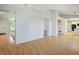 Bright living space featuring hardwood flooring and an open design with an adjacent kitchen area at 9524 Quail Ridge Dr, Las Vegas, NV 89134