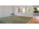 Open living room featuring carpet, hardwood flooring, decorative lighting, and a view of the backyard at 9524 Quail Ridge Dr, Las Vegas, NV 89134