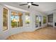 Bright living room showcasing hardwood flooring, expansive windows, and built-in shelving at 9524 Quail Ridge Dr, Las Vegas, NV 89134