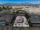 Aerial view of the home showcasing the backyard, covered patio, and surrounding landscape at 100 Eton St, Pahrump, NV 89048