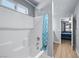 Clean bathroom with white tiled shower and tub, showcasing the shower curtain at 100 Eton St, Pahrump, NV 89048