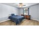 Cozy bedroom with natural light, wood floors, and a dresser at 100 Eton St, Pahrump, NV 89048