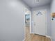Bright entryway featuring a white front door with decorative glass and neutral wall color at 100 Eton St, Pahrump, NV 89048