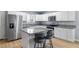 Bright kitchen featuring stainless steel appliances, granite countertops, and a convenient center island at 100 Eton St, Pahrump, NV 89048