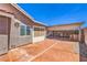 Spacious backyard with covered patio that includes an outdoor kitchen, perfect for al fresco dining at 1044 Spanish Needle St, Henderson, NV 89002