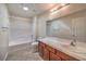 Bathroom featuring a tub and shower combo, toilet, vanity, and light neutral paint at 1044 Spanish Needle St, Henderson, NV 89002