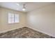 Bedroom featuring a ceiling fan, shuttered window, and neutral paint at 1044 Spanish Needle St, Henderson, NV 89002
