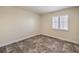 Bedroom featuring a shuttered window and neutral paint at 1044 Spanish Needle St, Henderson, NV 89002