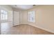 A bright bedroom with tile floors, shuttered windows, and a view to another room at 1044 Spanish Needle St, Henderson, NV 89002