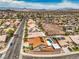 A suburban home with a refreshing pool and solar panels, blending comfort and eco-friendly living at 1044 Spanish Needle St, Henderson, NV 89002