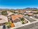 Charming home with a two-car garage, complemented by a landscaped front yard and a beautiful mountain view at 1044 Spanish Needle St, Henderson, NV 89002