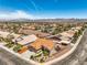 A neatly landscaped home featuring a two-car garage, a tiled roof, and low-maintenance desert landscaping at 1044 Spanish Needle St, Henderson, NV 89002