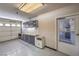 Garage featuring cabinets, shelving, and a door to the home's interior at 1044 Spanish Needle St, Henderson, NV 89002