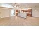 Open layout of the living room flows to the kitchen with granite countertops and stainless appliances at 1044 Spanish Needle St, Henderson, NV 89002
