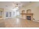 Cozy living room with tile flooring, a fireplace, and French doors at 1044 Spanish Needle St, Henderson, NV 89002