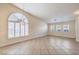 Bright living room showcasing tile floors and shuttered windows at 1044 Spanish Needle St, Henderson, NV 89002