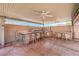 Outdoor kitchen area with seating, grill and ceiling fans for a great outdoor gathering place at 1044 Spanish Needle St, Henderson, NV 89002