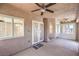A covered patio featuring ceiling fans, decorative doors, and neutral paint at 1044 Spanish Needle St, Henderson, NV 89002