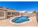 Backyard oasis with a swimming pool and jacuzzi, offering a perfect retreat on a sunny day at 1044 Spanish Needle St, Henderson, NV 89002