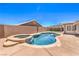 Sparkling pool with a built-in jacuzzi and patio, perfect for outdoor entertaining and relaxation at 1044 Spanish Needle St, Henderson, NV 89002