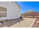 Desert landscaped backyard with gravel, retaining wall and drought-tolerant plants at 1073 Nordyke Ave, Henderson, NV 89015
