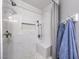 Gorgeous glass enclosed shower with marble tile, built in bench and rainfall shower head at 1073 Nordyke Ave, Henderson, NV 89015