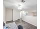 Upstairs bedroom with ceiling fan, wood-look floors, and large desk area at 1073 Nordyke Ave, Henderson, NV 89015