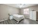 Cozy bedroom with neutral walls, ceiling fan, window, and bright white trim at 1073 Nordyke Ave, Henderson, NV 89015