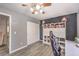 Cozy bedroom with closet, modern light fixture, wood-look floors, desk at 1073 Nordyke Ave, Henderson, NV 89015