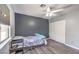 Cozy bedroom with closet, modern light fixture, and desk by window at 1073 Nordyke Ave, Henderson, NV 89015