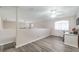Upstairs bedroom features wood-look floors, ceiling fan, desk and window at 1073 Nordyke Ave, Henderson, NV 89015