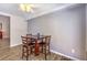 Dining area with a dark wood table, wood-look flooring, and a ceiling fan at 1073 Nordyke Ave, Henderson, NV 89015