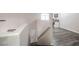 Bright stairwell leading to open landing, white walls, and wood look floors at 1073 Nordyke Ave, Henderson, NV 89015