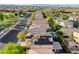 Extensive aerial view of neighborhood homes, some with solar panels and pools, in a well maintained community at 10988 Salernes St, Las Vegas, NV 89141