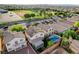 Aerial view of a beautiful home with solar panels, a sparkling pool and spa, and a well-manicured lawn at 10988 Salernes St, Las Vegas, NV 89141