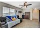 Second upstairs room with a window and couch with sports team decorations at 10988 Salernes St, Las Vegas, NV 89141