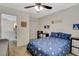 Bright bedroom features space-themed decor, ceiling fan, and view into study space at 10988 Salernes St, Las Vegas, NV 89141