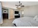 Bedroom featuring neutral paint, ceiling fan, carpet, and entry view to two other rooms at 10988 Salernes St, Las Vegas, NV 89141