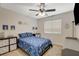 Cozy bedroom with ample natural light, ceiling fan, bed with blue space-themed linens at 10988 Salernes St, Las Vegas, NV 89141