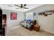 Upstairs room with a ceiling fan, comfortable seating, and natural light at 10988 Salernes St, Las Vegas, NV 89141