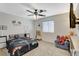 bedroom with a race car theme, ceiling fan, and a comfortable sitting area at 10988 Salernes St, Las Vegas, NV 89141