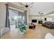 Dining area leads into a living space with tile floors, a modern table, and backyard access at 10988 Salernes St, Las Vegas, NV 89141
